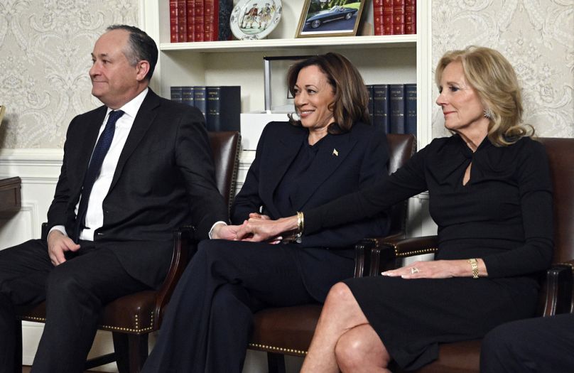 First lady Jill Biden, right, hold hands with Vice President Kamala Harris as President Joe Biden speaks from the Oval Office, in a farewell address Wednesday, Jan 15, 2025